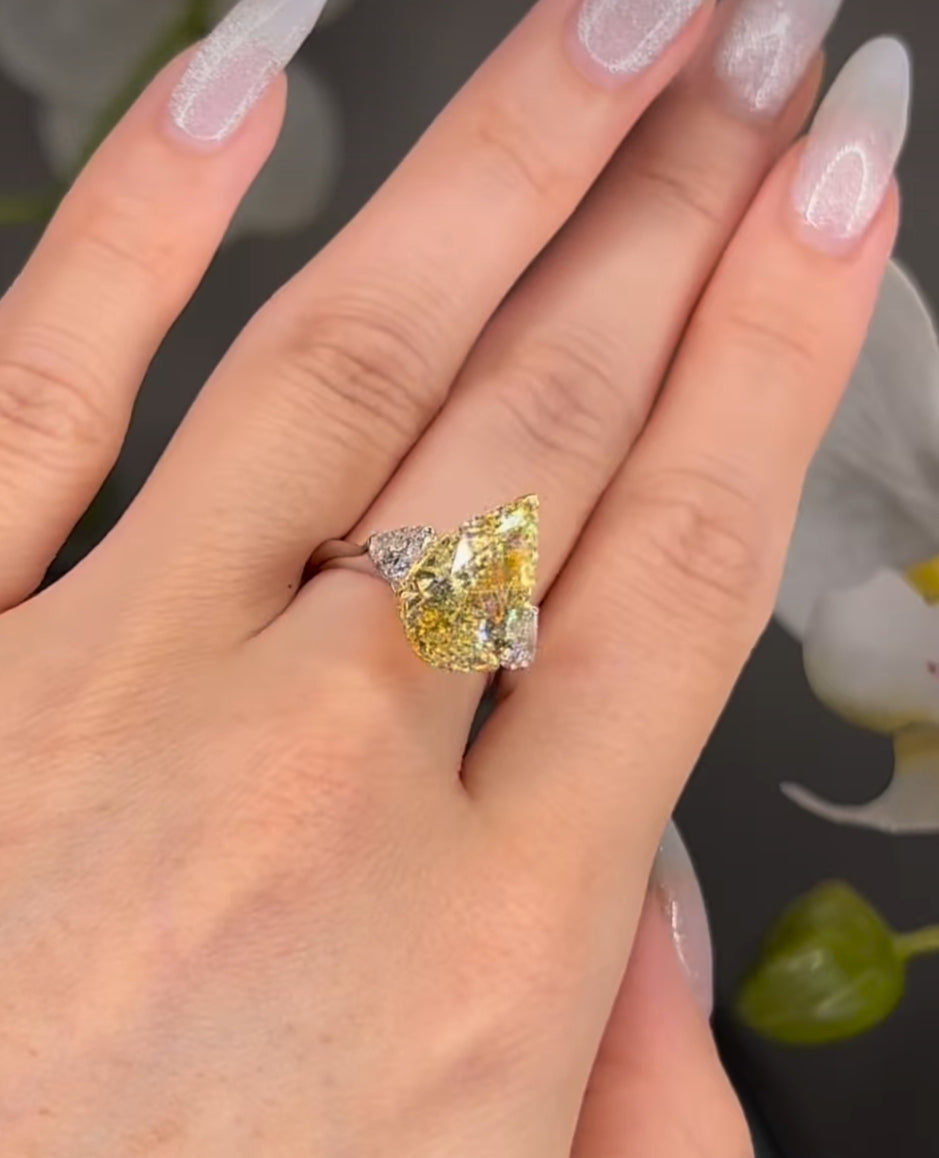 7*10 mm (2.10ct) pear shape fancy yellow and 4mm (0.60ct) White F VVS1 Labgrown diamond Engagement Ring with 14k white gold