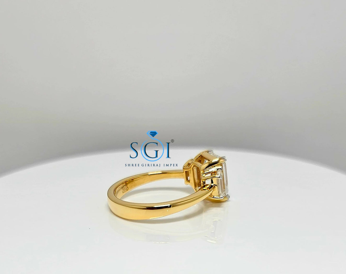 Elegant Emerald Cut Moissanite Engagement Ring – 3-Stone Yellow Gold Setting