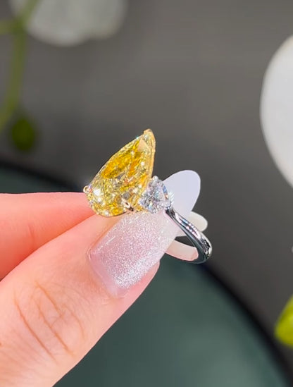 7*10 mm (2.10ct) pear shape fancy yellow and 4mm (0.60ct) White F VVS1 Labgrown diamond Engagement Ring with 14k white gold