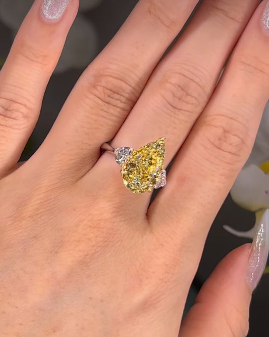 7*10 mm (2.10ct) pear shape fancy yellow and 4mm (0.60ct) White F VVS1 Labgrown diamond Engagement Ring with 14k white gold
