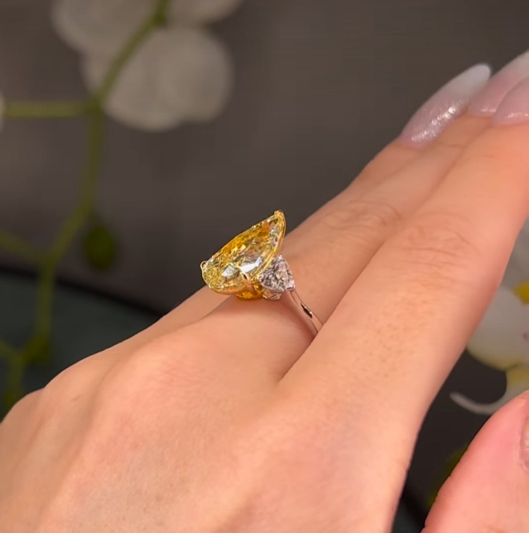 7*10 mm (2.10ct) pear shape fancy yellow and 4mm (0.60ct) White F VVS1 Labgrown diamond Engagement Ring with 14k white gold